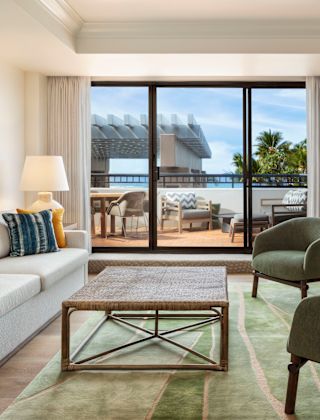 Suite Living Area and a Large Balcony in a Hotel Suite