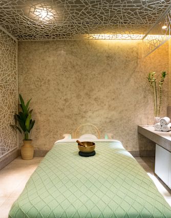 A massage table in a relaxing room at the spa
