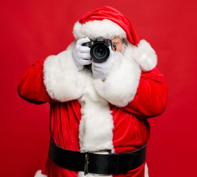 Santa taking a picture with a camera