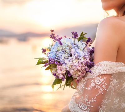 Closeup of bride and bouquet with the ocean in background