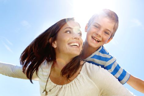 Woman and Little Boy Laughing in the Sun