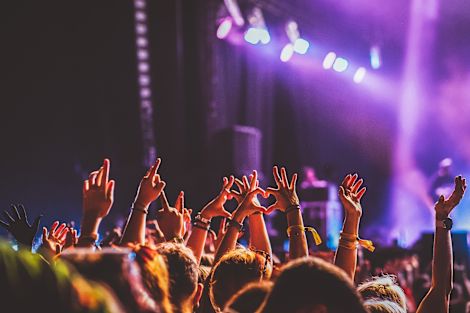 Peoples hands in air at concert