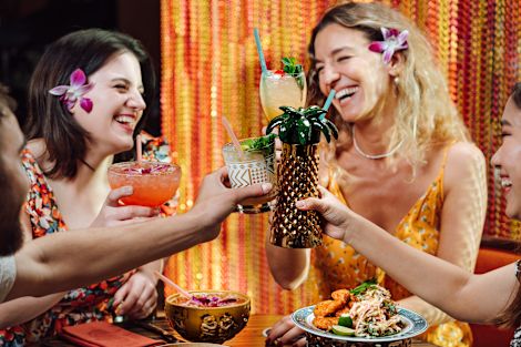 Women Smiling with Festive Drinks