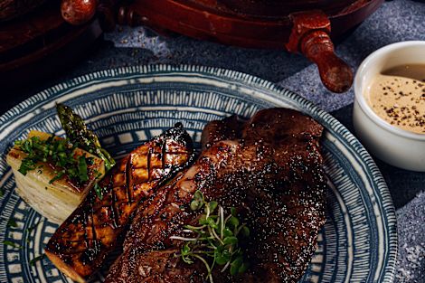 Steak and Salmon Dish on a Plate at Trader Vics