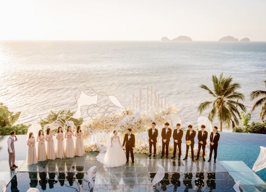 Wedding group with ocean behind