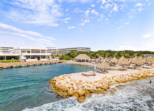 People Enjoying a Day on a Beach at the Hotel