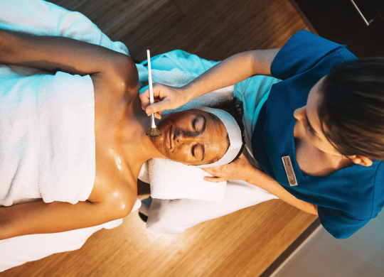 Woman Receiving Facial in Spa