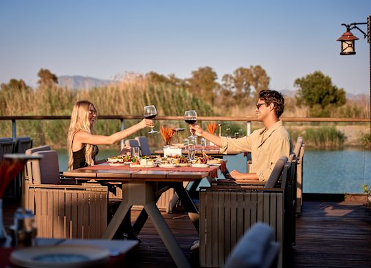 Couple dining at A La Turca restaurant by the water
