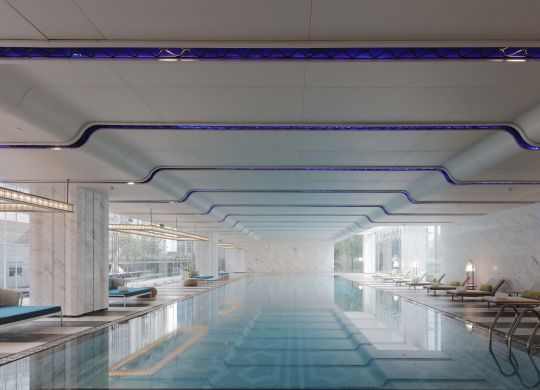 Swimming pool view with loungers
