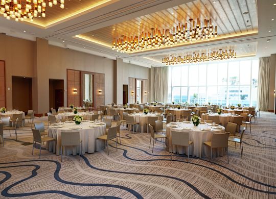 Spacious Ballroom Area with Round Tables and Chairs