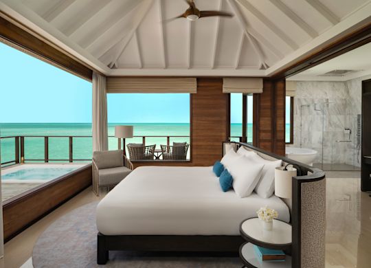 Bed in room with chair