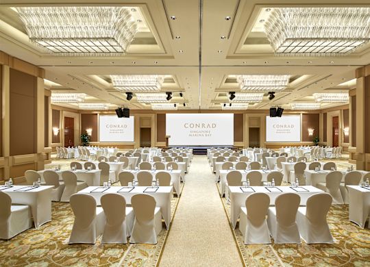 The Ballroom Classroom setup with white tables and chairs