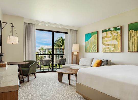 Bed in a Guest Room, Living Area and Balcony