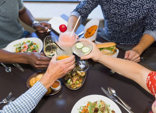 People enjoying food a drinks