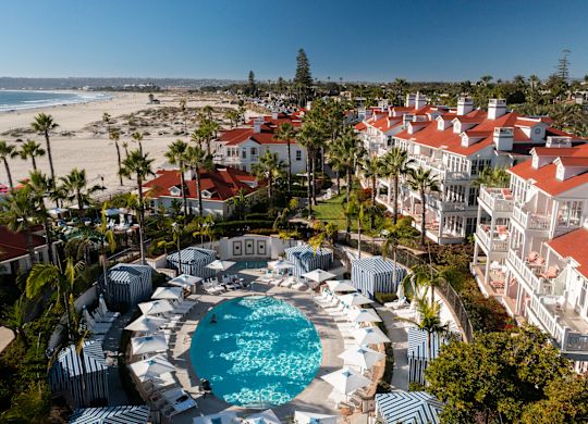 Aerial view of hotel and pool with beach view