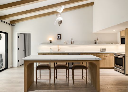 Villas Serene guest villa kitchen with large marble island and stools