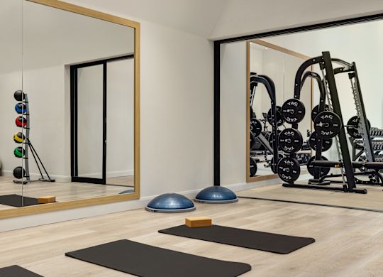 Things to Do Hotel fitness center with yoga mats and weight machines