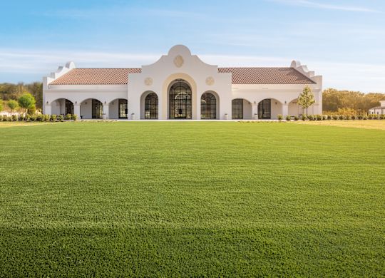 The Calera Exterior View of The Calera Meeting Venue with a Large Field in Front