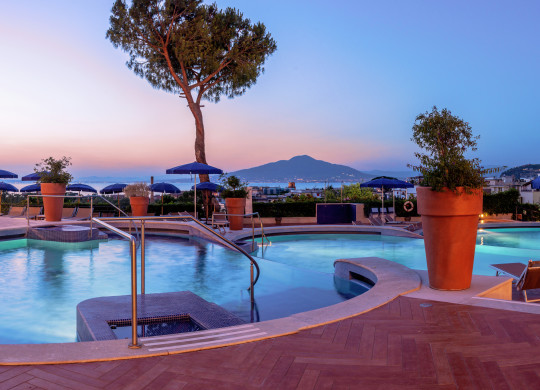 Outdoor Pool and Lounge Area at Dusk