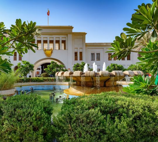 Hiltorical Building Bab Al Bahrain with a Large Fountain and Garden
