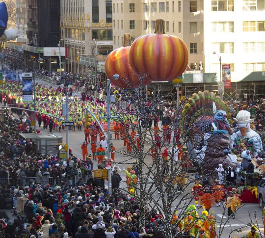 Macy's Day Thanksgiving Parade with pumpkins and animal balloons