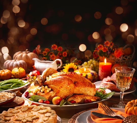 Thanksgiving table, turkey, pie, wine, pumpkins, candles