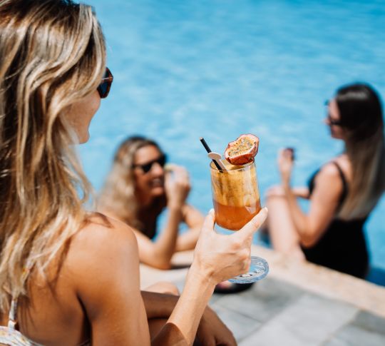 Ladies Enjoying Drinks at Lillet Pool Bar