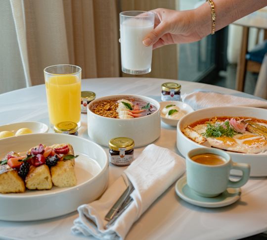 In room dining setup by staff member