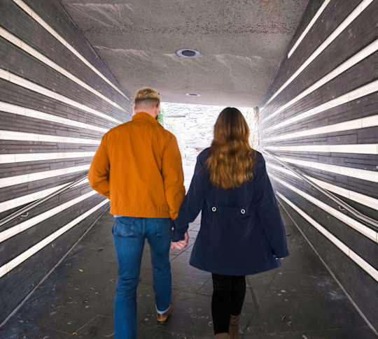 Couple Walking Thru Irish Memorial Tunnel