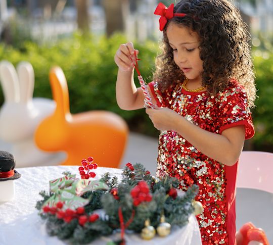 Girl Decorating for the Holidays