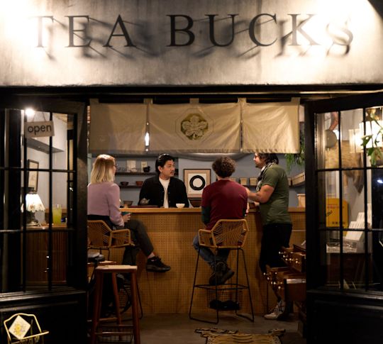 People Enjoying Drinks at Tea Buck