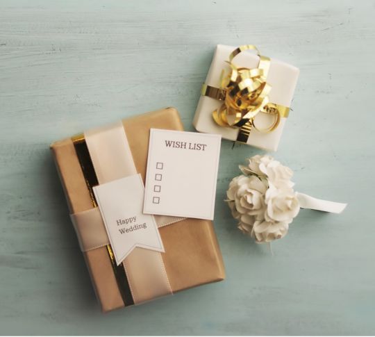 Closeup of two wrapped wedding gifts
