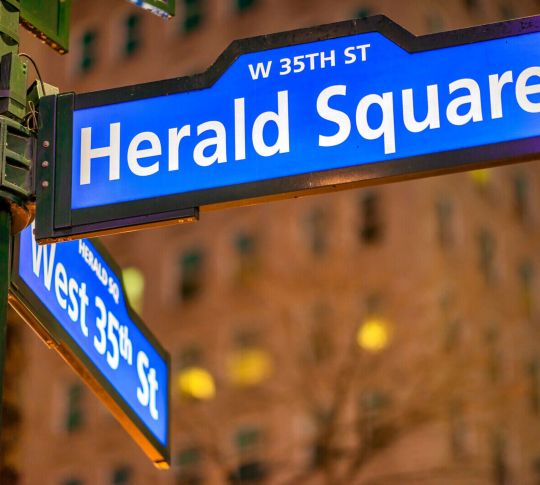 Herald Square street sign at night