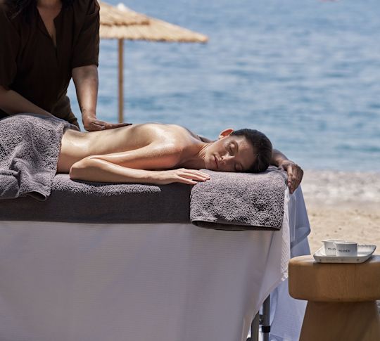 a Woman Getting a Massage at the Beach