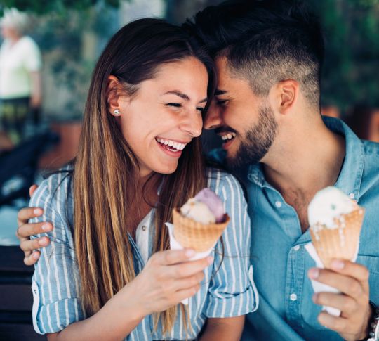 Couple Smiling Holding Ice Cream Cones