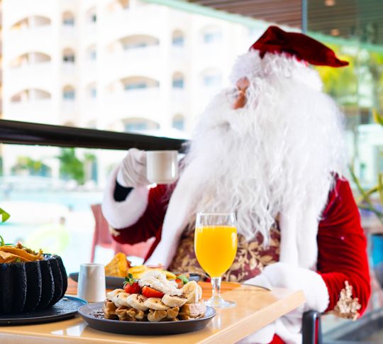 Santa Claus Having Breakfast in a Restaurant
