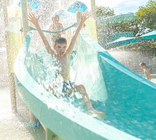 Kids Enjoying a Water Slide at Jade Waters Water Park