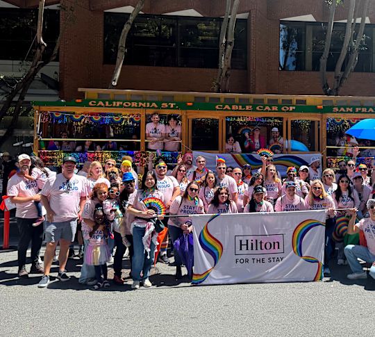 A Group of People at the Hilton Pride 2025 Event