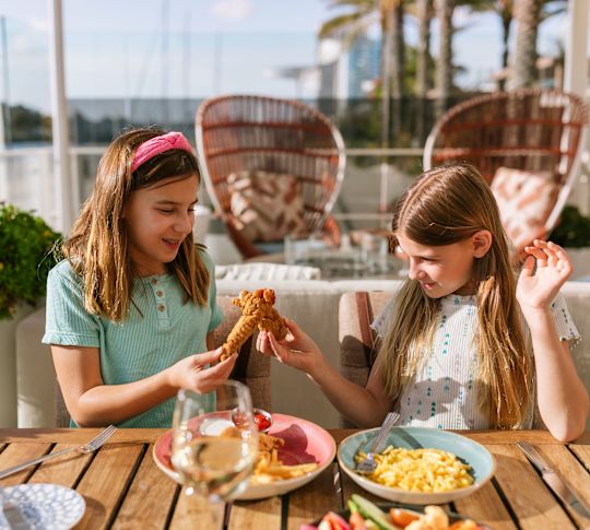girls having lunch on the terrace of Hudson & Nash restaurant