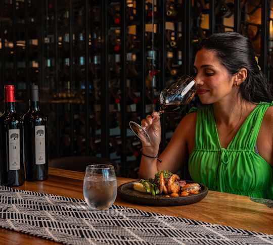 Woman enjoying a wine tasting experience