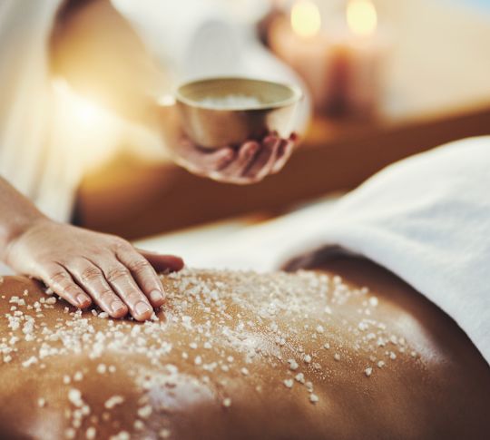 Person receiving salt massage
