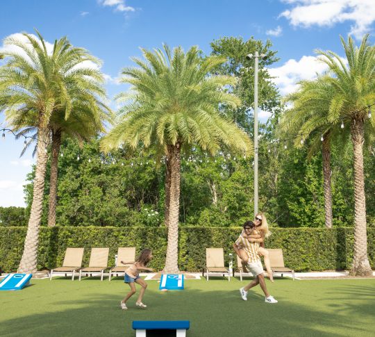 family playing on outdoor gaming grounds