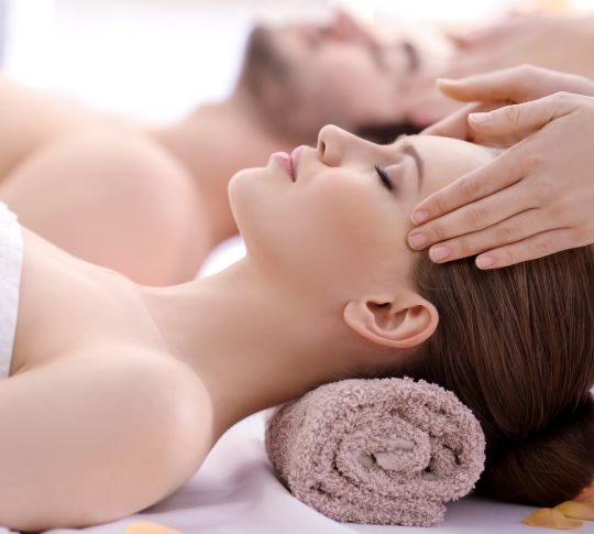 Couple having head massage