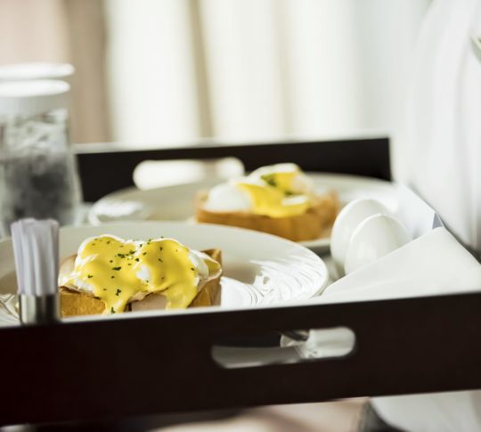 Room Service delivered on tray with eggs on toast