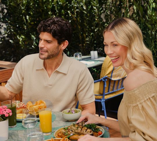 Couple Dining on the Terrace of The Veranda Restaurant-transition