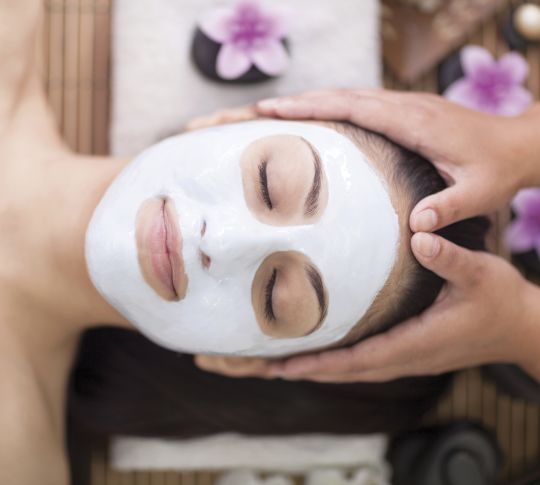 Woman Receiving Spa Facial and Massage