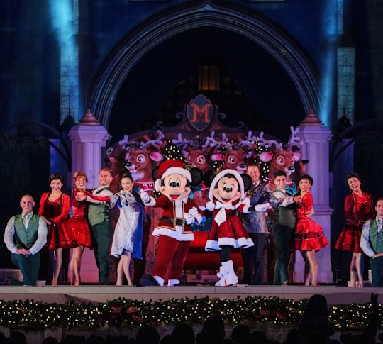 christmas stag show, micky and mini mouse dressed in santa suits