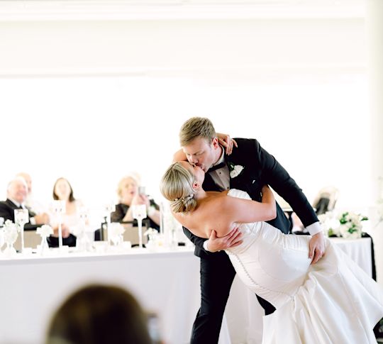 Bride and Groom  Kissing in a Ballroom with Guests-transition