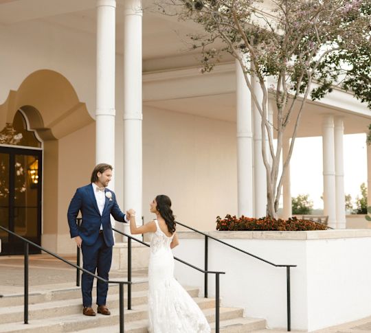 Bride and Groom  Posing on the Stairs of Hotel Entrance-transition