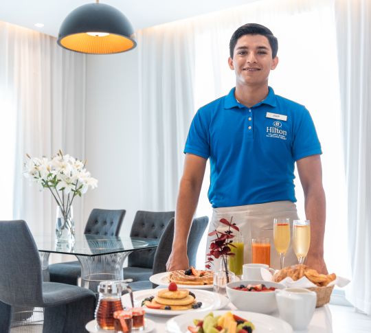 hotel staff delivering room service, breakfast
